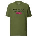 Front view of the 'Army of Faith' T-shirt in Army Green, featuring bold black text and a distinctive pink button design. Inspired by Ephesians 6:11, this shirt makes a strong faith statement while offering a comfortable and stylish fit.