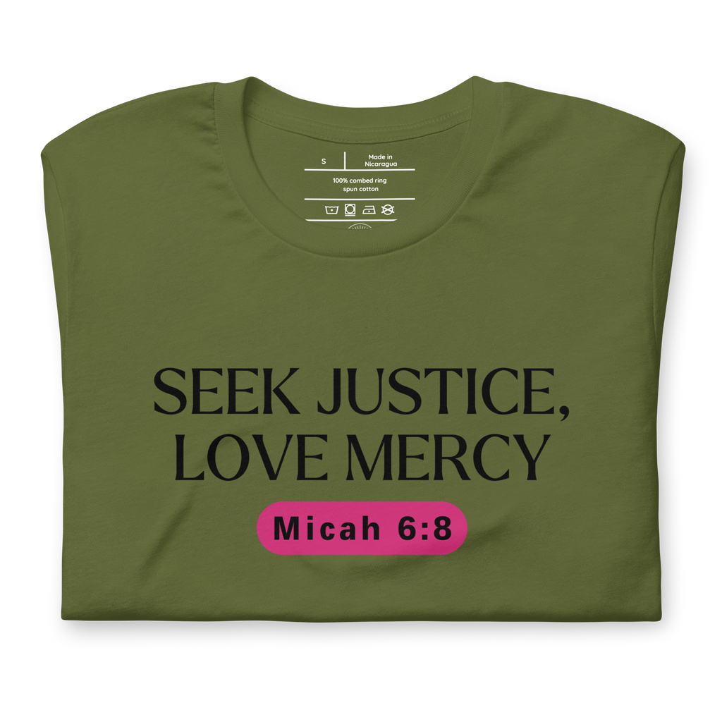 Folded 'Army of Faith' T-shirt in Army Green, featuring bold black text and a pink button-like design. Crafted from 100% combed and ring-spun cotton, this faith-inspired tee showcases a powerful message with comfort and style.