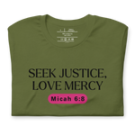 Folded 'Army of Faith' T-shirt in Army Green, featuring bold black text and a pink button-like design. Crafted from 100% combed and ring-spun cotton, this faith-inspired tee showcases a powerful message with comfort and style.