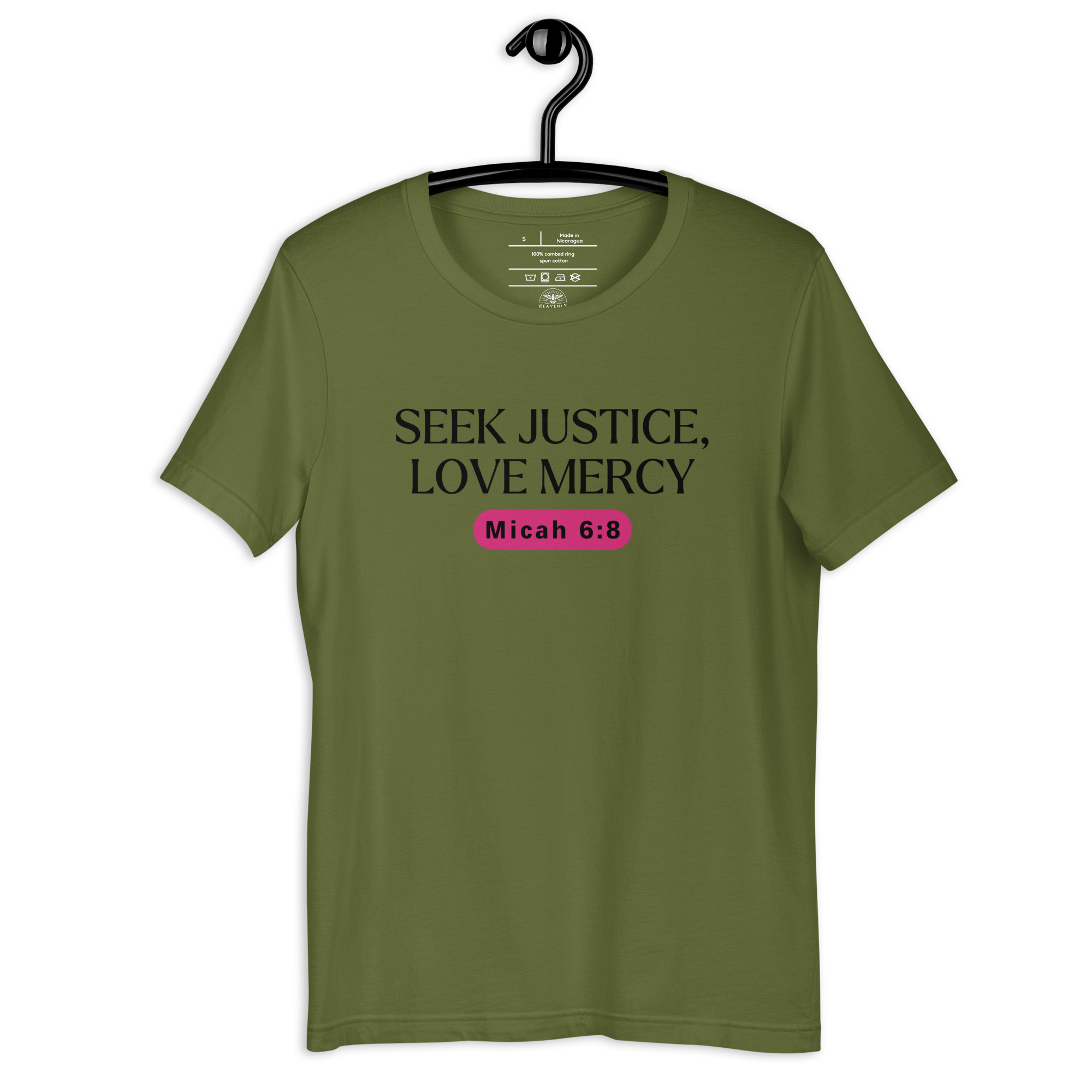 Army Green 'Army of Faith' T-shirt hanging on a wooden hanger, featuring bold black text and a pink button-like design. Made from 100% combed and ring-spun cotton, this shirt embodies a strong statement of faith and style.
