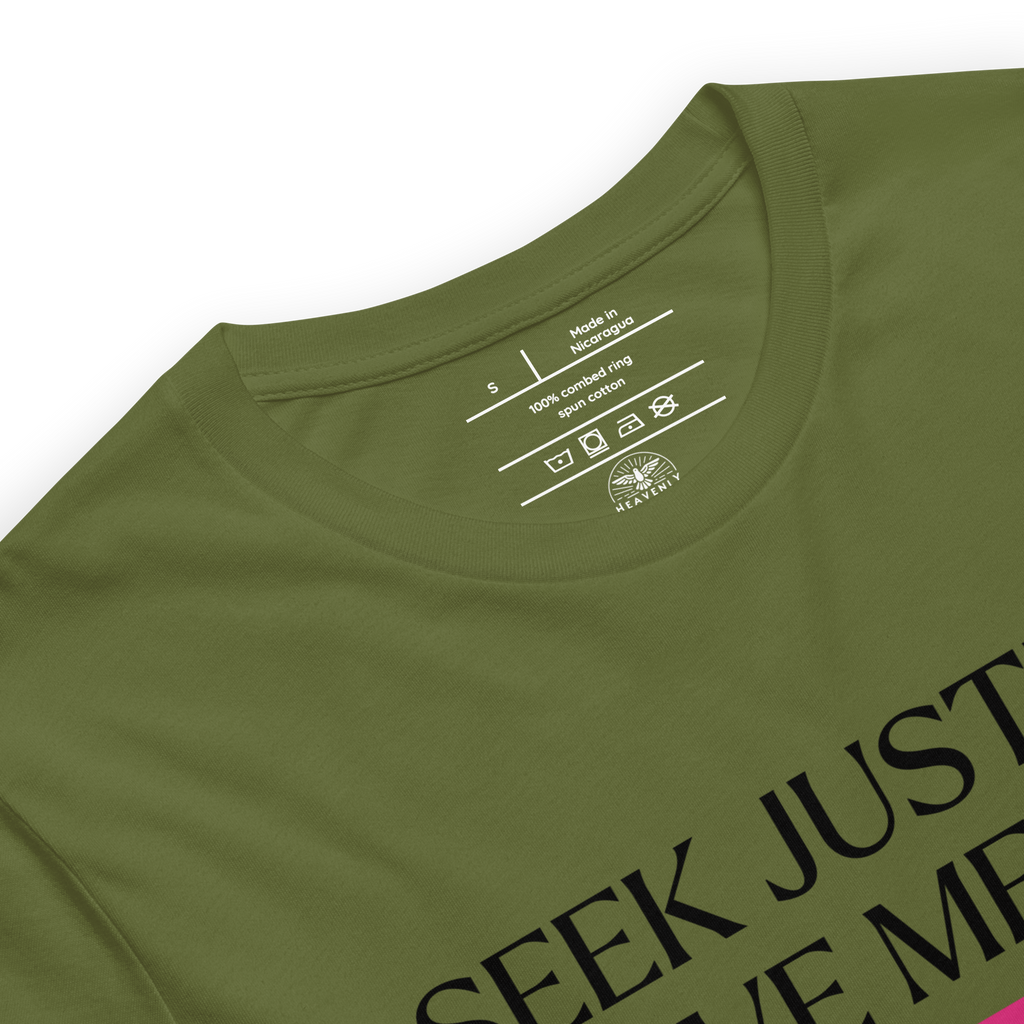 Logo stamp inside the 'Army of Faith' T-shirt in Army Green, highlighting brand details and care instructions. Features soft, durable fabric with a design inspired by Ephesians 6:11, emphasizing quality and faith-driven craftsmanship.