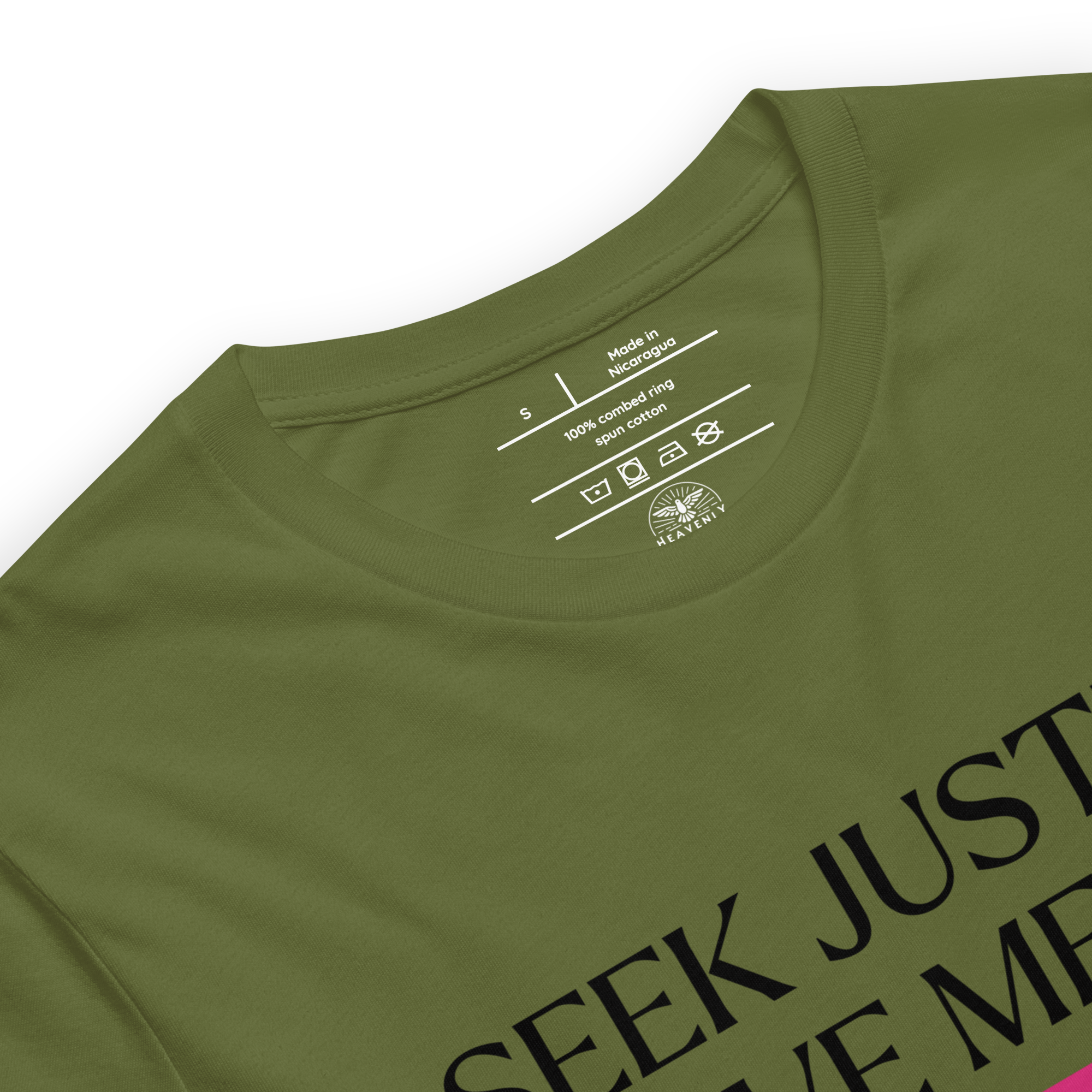 Logo stamp inside the 'Army of Faith' T-shirt in Army Green, highlighting brand details and care instructions. Features soft, durable fabric with a design inspired by Ephesians 6:11, emphasizing quality and faith-driven craftsmanship.