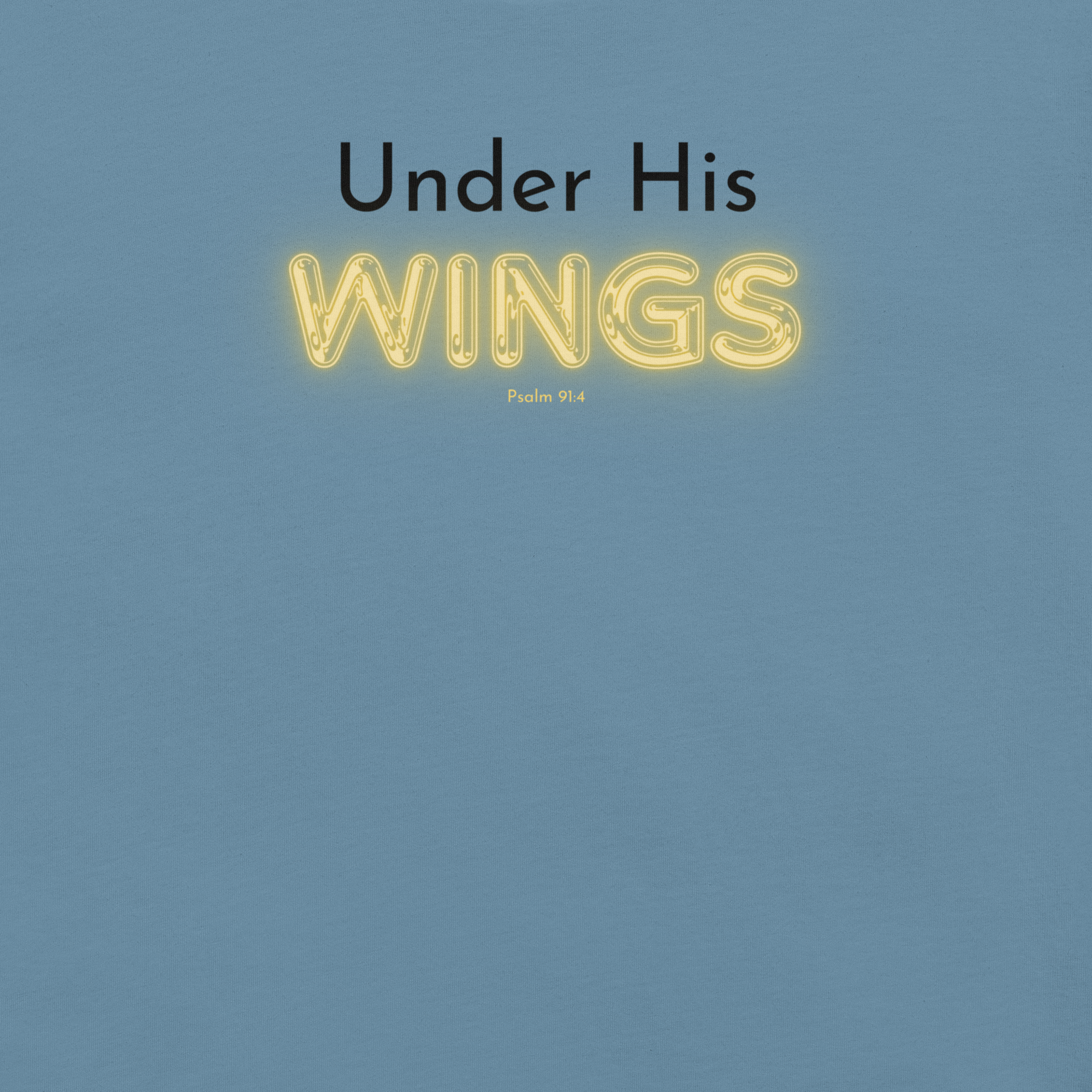 Close-up of 'Under His Wings' text in black and glowing yellow on navy blue T-shirt.