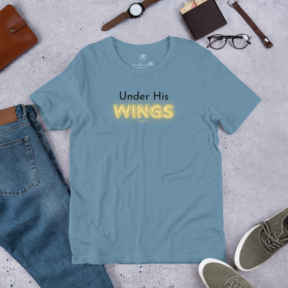 Main display mockup of 'Under His Wings' T-shirt in shop setting, navy blue color.