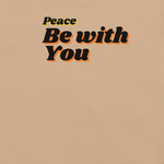 Logo stamp inside navy 'Peace Be With You' T-shirt, showing brand and care instructions.