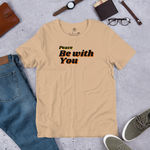 Main display mockup of navy 'Peace Be With You' T-shirt in a store setting.
