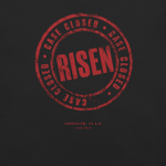 Close-up of Gospel Noir Case Closed Risen stamp graphic on black Christian t-shirt