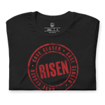 Close-up of Gospel Noir Case Closed Risen stamp graphic on black Christian t-shirt... Folded Gospel Noir Case Closed Risen John 3:16 black Christian t-shirt