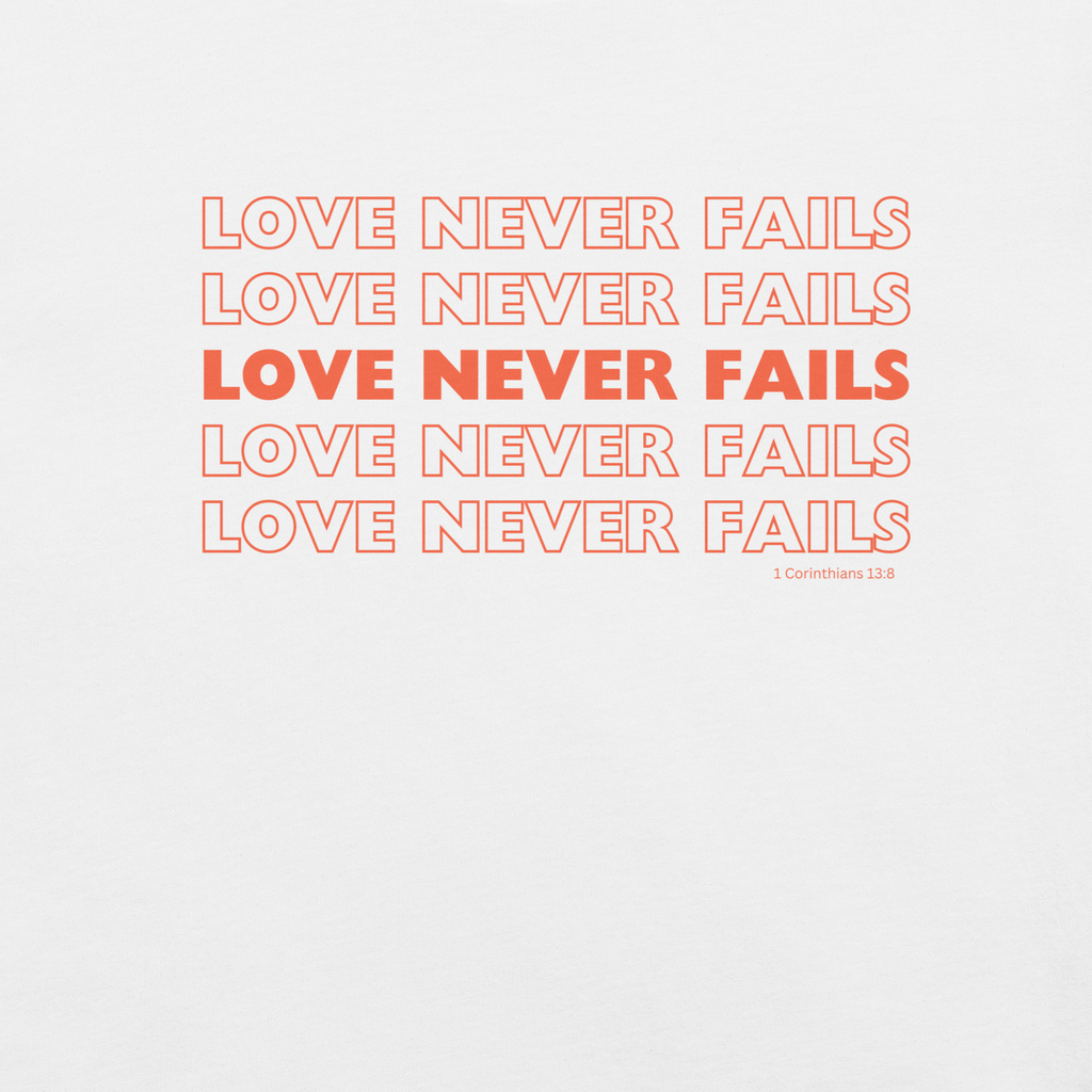 Inside label of 'Love Never Fails' T-shirt showing care instructions.