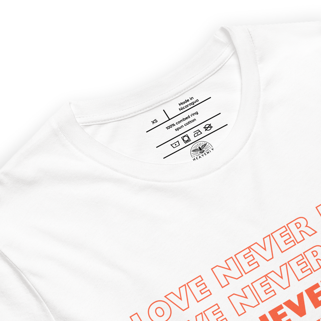 "Inside label of 'Love Never Fails' T-shirt showing care instructions."