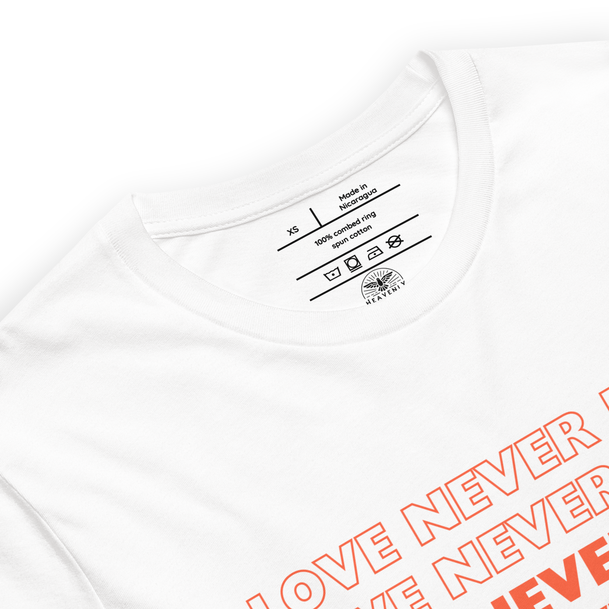 "Inside label of 'Love Never Fails' T-shirt showing care instructions."
